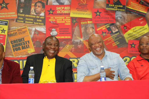 LIGHTER MOMENT: ANC Deputy President Cyril Ramaphosa and fired deputy finance minister Mcebisi Jonas share a moment of laughter at the Chris Hani Memorial Lecture yesterday ZINGISA MVUMVU