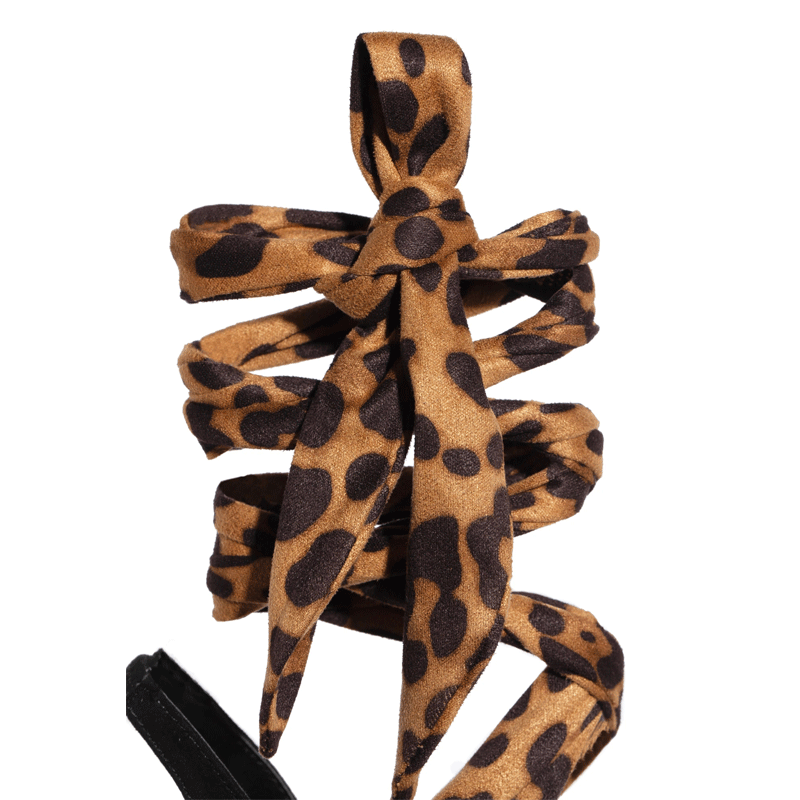 Tacchi alti sexy con stampa leopardata Seduci con questi tacchi leopardati, l'accessorio perfetto per un look audace e femminile. Comfort e stile.