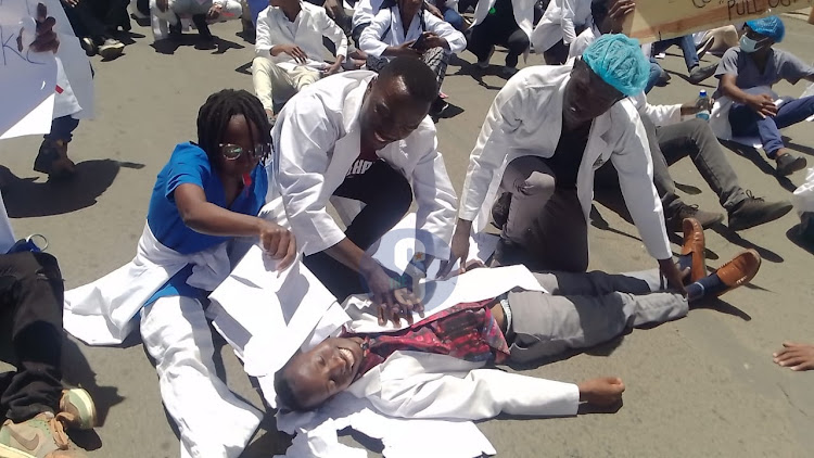 Healthcare workers gather at a Nakuru street during their demos on Tuesday, March 26, 2024.