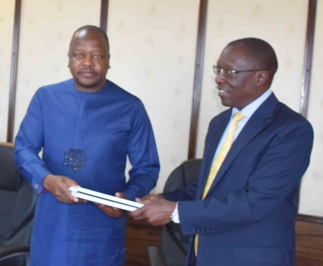 The Managed Equipment Services Management Committee led by the Kenyatta Hospital chairman George Ooko hands over a copy of the report to Health CS Mutahi Kagwe at Afya House on January 14.