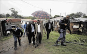 WAR ZONE:
       eThekwini mayor James Nxumalo  visits KwaMashu hostel where 
      
       incidents of political violence have flared 
      
      
      
      PHOTO: TEBOGO LETSIE