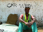 Ayanda Kunene, 30, has never had a permenant job. He started his own car wash in October 2018 after years of searching for work. 