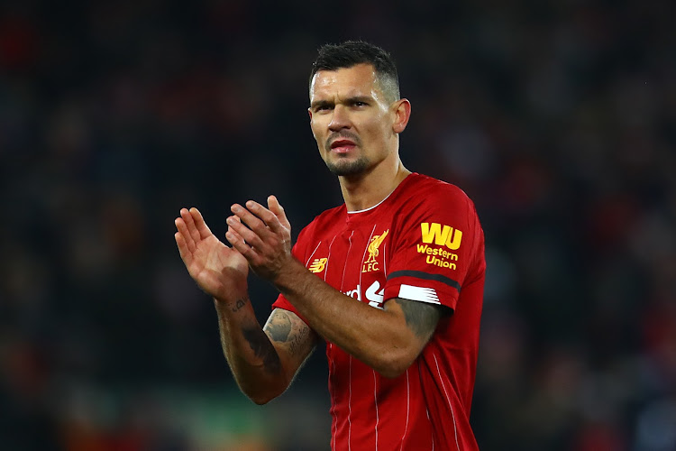 Dejan Lovren of Liverpool applauds the supporters following the Premier League match between Liverpool FC and Brighton & Hove Albion at Anfield on November 30, 2019 in Liverpool, United Kingdom.