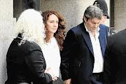 ACQUITTED: Rebekah Brooks and her husband, Charlie, leave the Old Bailey yesterday after being cleared of all charges against them. Andy Coulson, another former editor, was convicted of plotting to hack phones