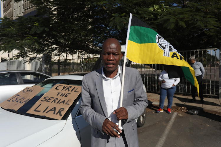 Nkosenhle Shezi outside the Durban Central police station where a civil rights organisation opened a case of corruption against President Cyril Ramaphosa.