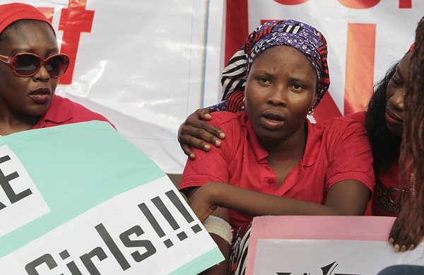 Isaac Rebecca, one of the girls that escaped from the Boko Haram camp, is comforted. Picture: REUTERS