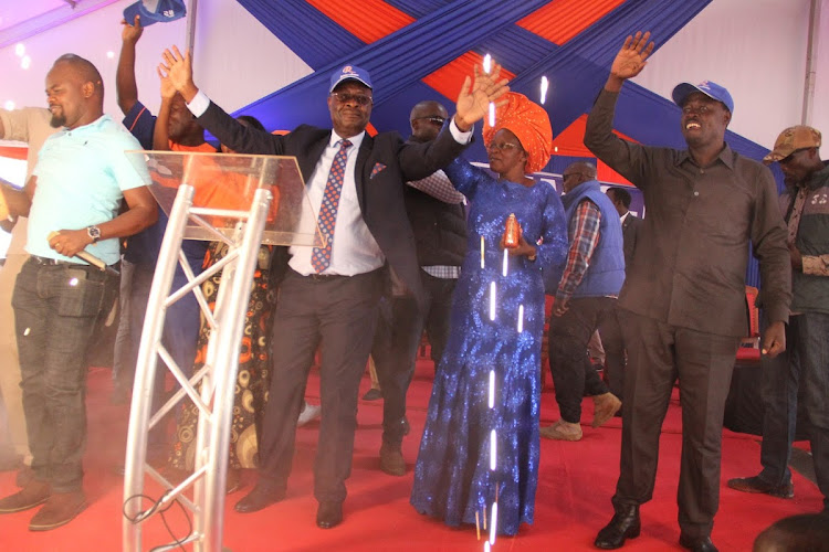 Homa Bay governor aspirant Isaiah Ogwe, his wife and Homa Bay Town MP Peter Kaluma during his launch for the seat on March 19,2022