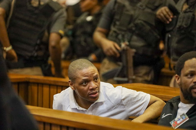 Carlos Mncube, left, one of the accused in the Senzo Meyiwa murder trial at the Pretoria High Court.