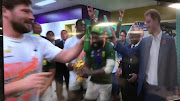 A screenshot of a Twitter copy of a television image shows Prince Harry accepting a sip of a Heineken beer from the Springboks, visiting their change room at International Stadium Yokohama after they beat England 32-12 to win the 2019 Rugby World Cup final on Saturday.