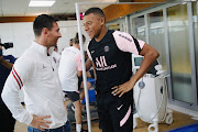 Lionel Messi meets his new PSG teammate Kylian Mbappé ahead of a training session in Paris on August 12 2021. 
