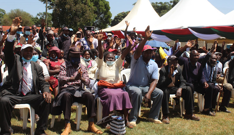 Farmers follow proceedings during the launch of the sensitisation forum for the coffee inputs subsidy programme at Karatina Stadium in Nyeri