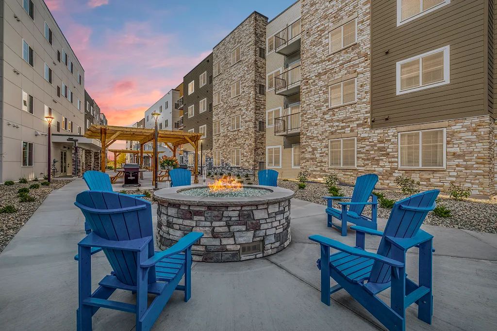 WaterWalk Minneapolis - Plymouth outdoor seating area around fire pit at dusk