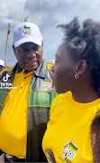 President Cyril Ramaphosa talks to Slindokuhle Khoza during
the ANC election campaign in Orange Farm. 