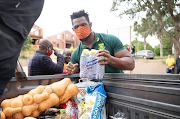 Siya Kolisi, the captain of the national rugby team, partnered with the Nelson Mandela Foundation in distributing food parcels on Freedom Day. 