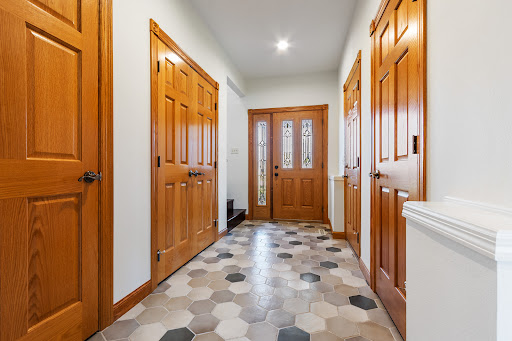 Hallway with glazed front door in this luxury house for sale in Sioux Falls ($589,900)