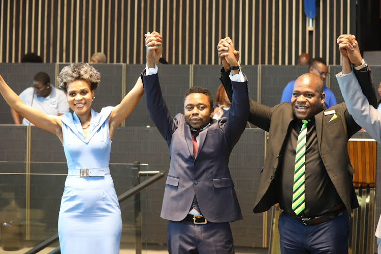 City of Johannesburg speaker Colleen Makhubele, left, with new mayor Thapelo Amad, centre, and council whip Nkosephayo Zungu after Amad's election.