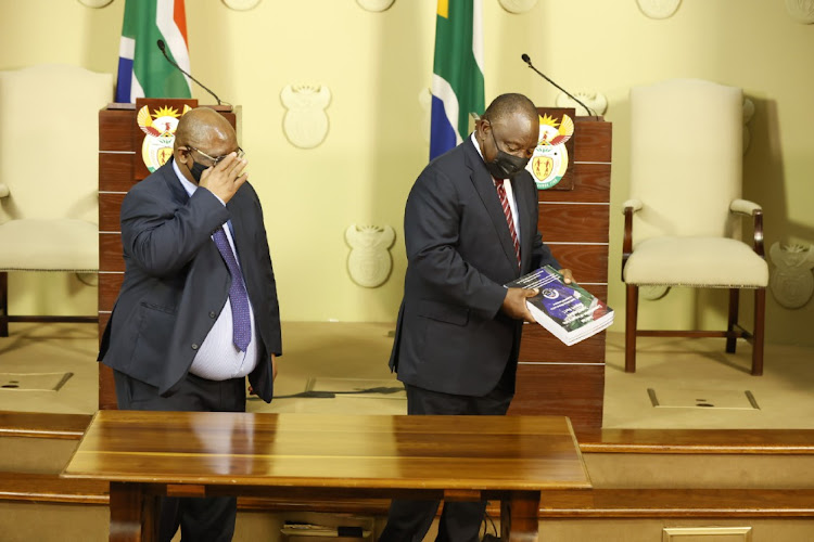 Acting Chief Justice and Chair of the Commission of State Capture Raymond Zondo hands over part 1 of the State Capture Report to President Cyril Ramaphosa at the Union Buildings in Pretoria.