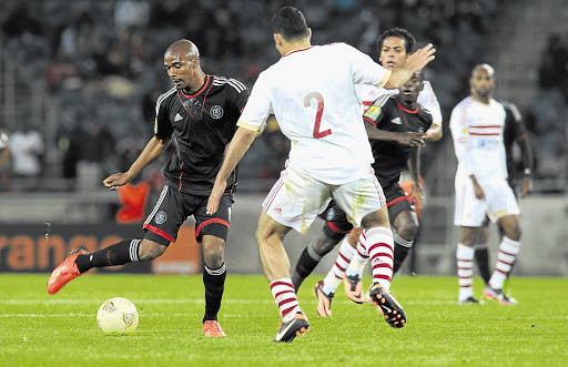 MAGIC TOUCH: Lennox Bacela dribbles past Salam Mohamed Soliman Ebrahim during the CAF Champions League match between Orlando Pirates and Zamalek at Orlando Stadium last month.