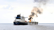 Smoke rises from Marlin Luanda, merchant vessel, after the vessel was struck by a Houthi anti-ship missile, at the location given as Gulf of Aden, in this handout picture released January 27, 2024. 