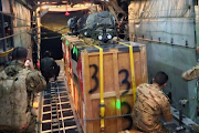 Jordan's air force personnel air-dropping urgent medical aid to the Jordanian field hospital in Gaza.