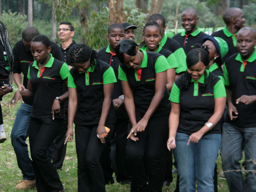 Safaricom employees dance during a past CSR activity. /FILE