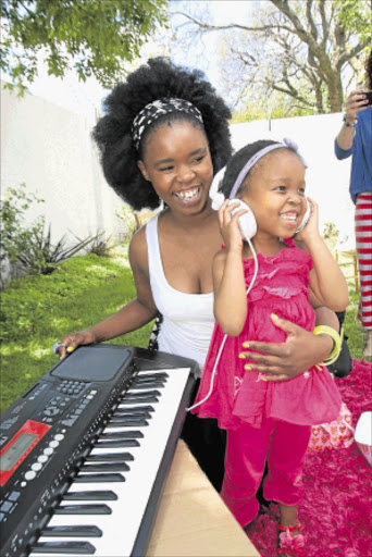 ECSTATIC: Opelong Madisakwane who needs a kidney transplant with her idol Zahara at Melville in Johannesburg. PHOTO: VELI NHLAPO