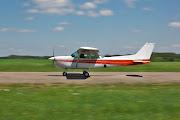 The passenger landed the single engine Cessna 208 with the help of an air traffic controller.