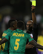 Referee Thando Ndzandzeka erroneously issues out a second yellow card to Lamontville Golden Arrows defender Limbikani Mzava during the Absa Premiership match against Orlando Pirates at Princess Magogo Stadium on March 17, 2018 in Durban, South Africa. 