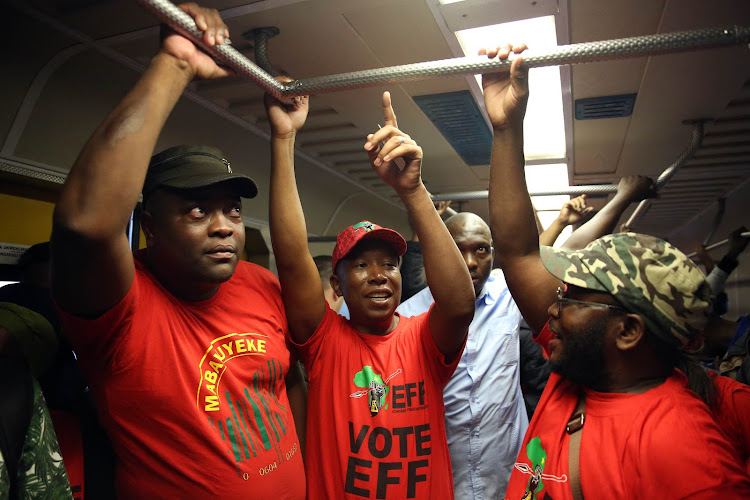 EFF leader Julius Malema on a packed train from Umlazi to Berea station, Durban, during the party's election campaign on Tuesday.