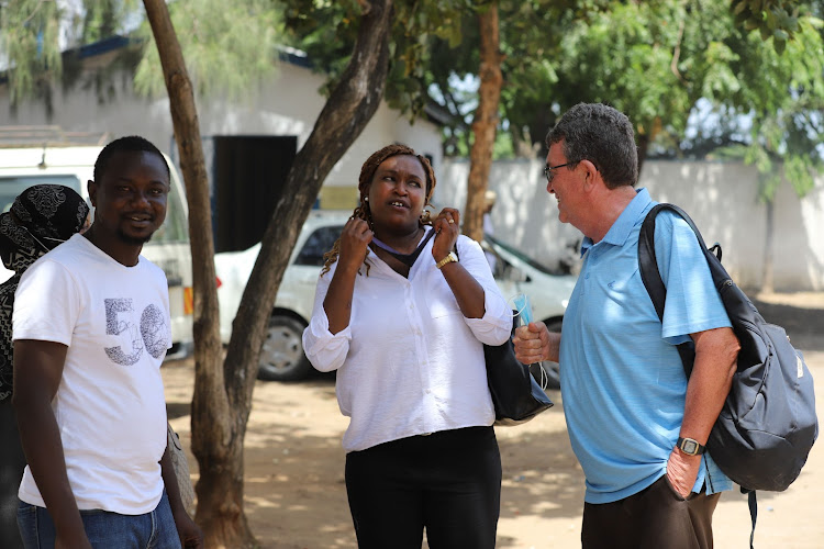 InformAction executive director Winnie Masai [C] and Haki Yetu Organization boss Father Gabriel Dolan at Tononoka Hall in Mombasa on Tuesday.