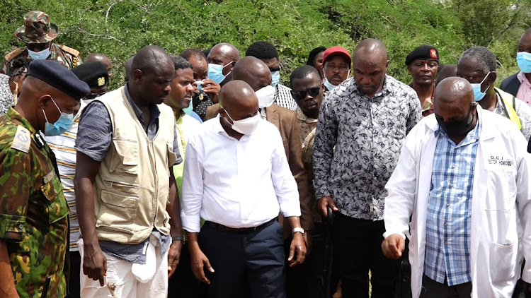 Interior CS Kithure Kindiki (in White) arrives at the Shakahola mass grave site where 90 bodies have so far been retrieved in Magarini Kilifi County.