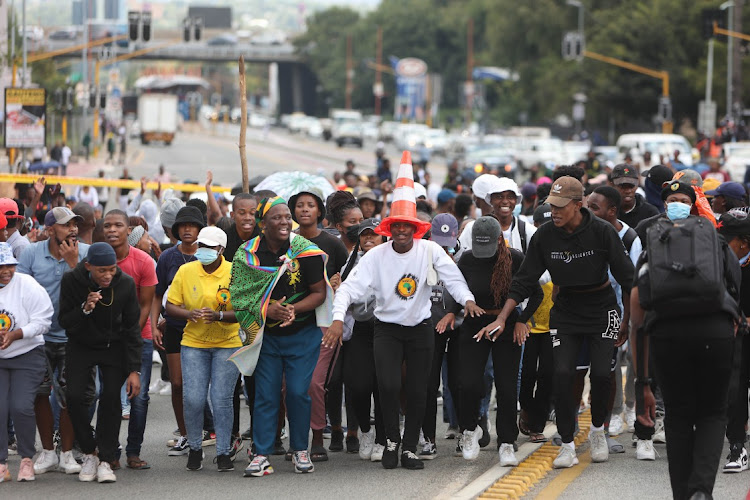 Protesting students march in Empire Road near Wits University on Thursday.