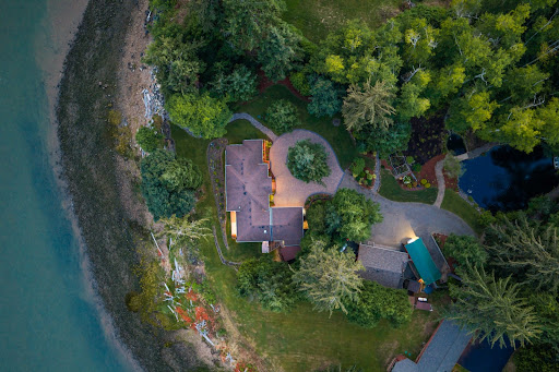 Aerial view waterfront house, lush garden in this luxury house for sale in Naselle ($1,995,000 - 264 m²)