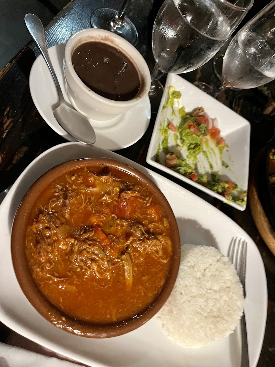 Ropa Vieja - Twice Cooked Slow Braised Skirt Steak, Tomato Pepper Sauce, White Rice, Black Beans