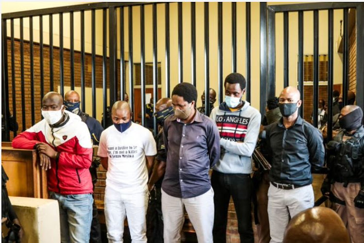 The five suspects implicated in Senzo Meyiwa's murder during a court appearance. Zamkhule Mbatha is suing the state for his wrongful arrest in connection with the murder seven years ago