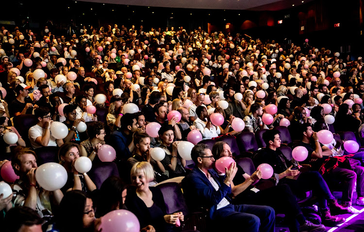 Enni Kukka Tuomala gets DI audience to try a simple exercise in 'empathy building' by using a pink balloon.