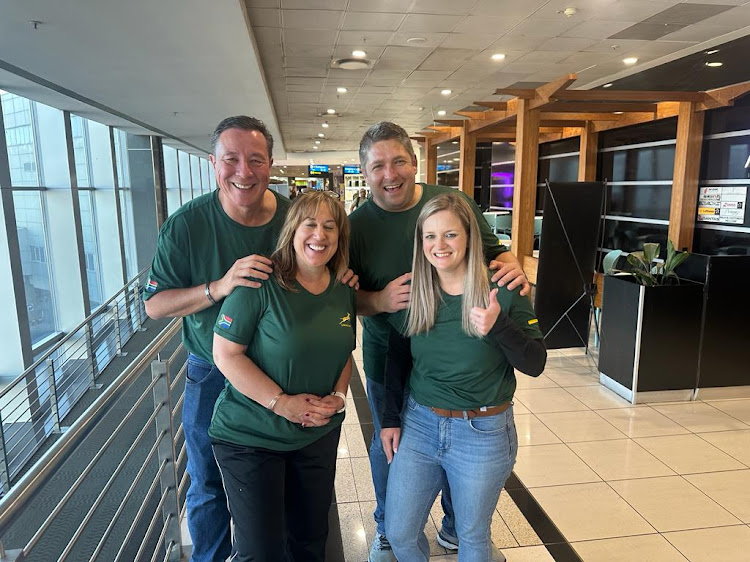 Paul and right couple Jodie Rouessart (left) and Lourens and Marietjie van Eck depart OR Tambo International Airport for Paris on Wednesday to support the Boks against Ireland.