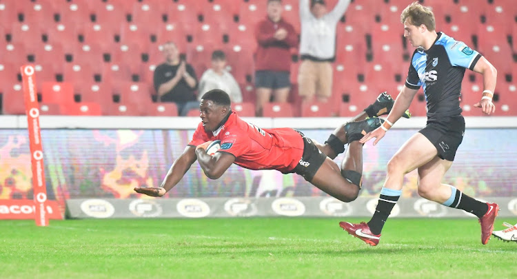 Emmanuel Tshituka of the Lions scores the try that seals their bonus point in their win over Cardiff at Ellis Park on Saturday.