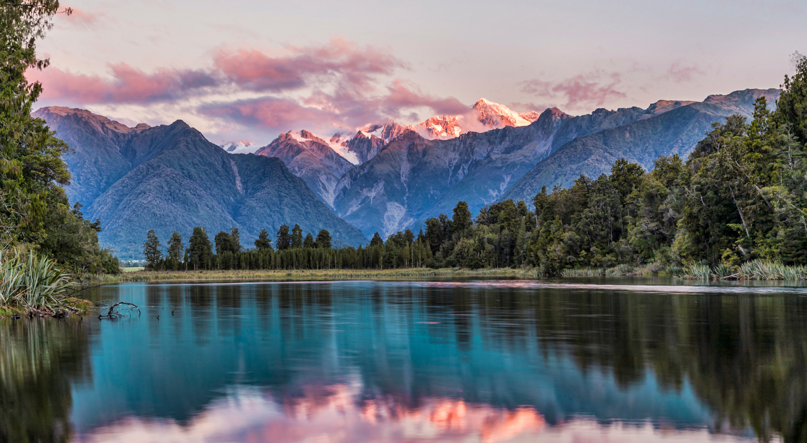 A to Z Bucket List - scenic view of lake with mountains in background in New Zealand