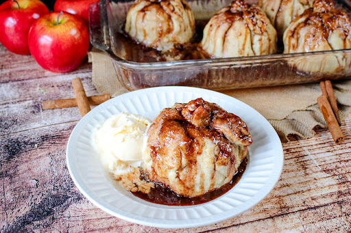 Homemade Apple Dumpling on a plate with ice cream.