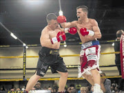 SETTING RECORD STRAIGHT: Dwayne Combrink, right, catches Sylvester Zaki with a right hook during their  Gauteng middleweight championship clash at Emperors Palace in Ekurhuleni
      Photo: N-Squared