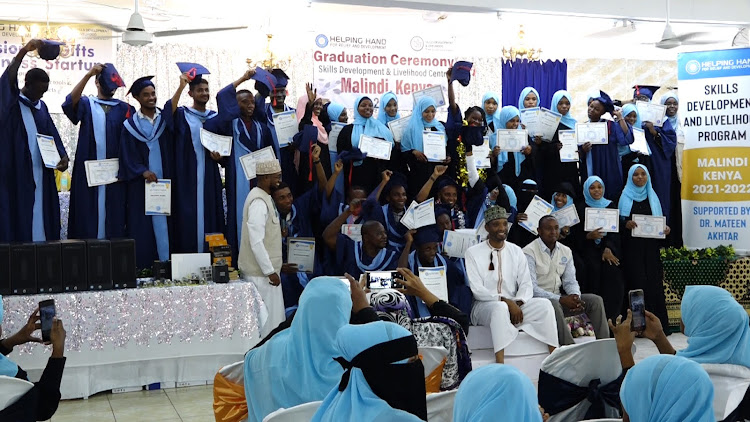 Some of the youth who graduated with different TVET skills show their certificates during the graduation ceremony organised by Helping Hand for Relief and Development in Malindi