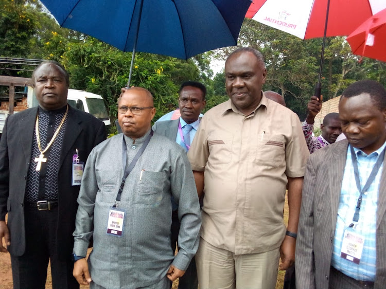 Apostle David Juma ( in a badge) with other Bishops addressing a press briefing at Deliverance Church in Bungoma Town on October,7,2022.