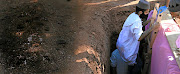 In Westpark Cemetery, Johannesburg,  an 80-year-old man who died of Covid-19   is buried by his family and friends. They permitted photographs on condition that their identities and those of their loved one be protected. In the Muslim section of the cemetery alone, more than  25 graves are marked 'CD' to indicate Covid-19 as the cause of death. 