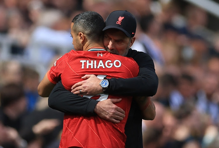 Liverpool's Thiago Alcantara is embraced by manager Jurgen Klopp