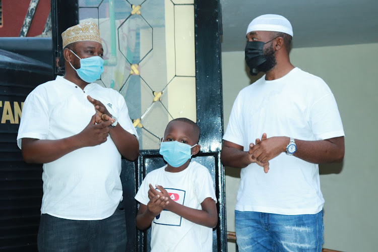 Jomvu MP Badi Twalib, Twalib Badi Jr and Mombasa Governor Hassan Joho at Twalib's Miritini home on Sunday.