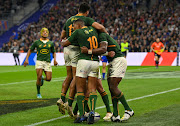 Springbok captain Siya Kolisi Africa celebrates scoring a try with teammates during their clash with France at Stade Velodrome in Marseille on November 12.