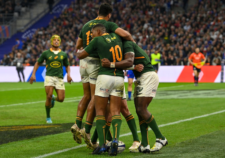 Springbok captain Siya Kolisi Africa celebrates scoring a try with teammates during their clash with France at Stade Velodrome in Marseille on November 12.