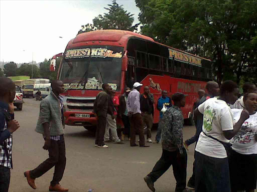 A Prestige company bus that matatu operators at Hashi petrol station in Kericho town used to block Kisumu-bound vehicles, during protests against lawyer Miguna Miguna's stay in police custody, February 6, 2018. /Sonu Tanu