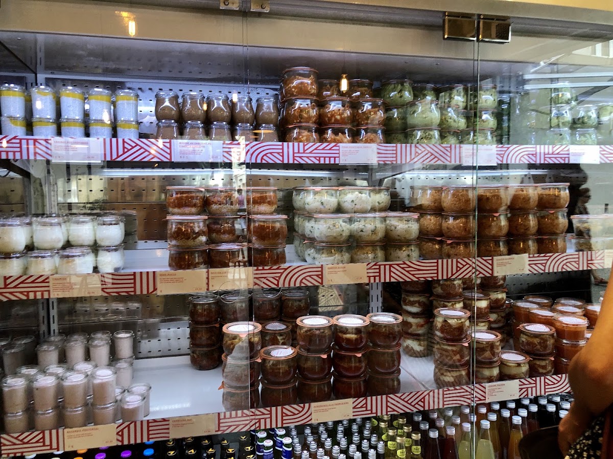 The foods are in this refrigerator in glass containers. You pick what you want and bring it to the counter. The items that require heating will be heated at the counter and the bread is in a basket.